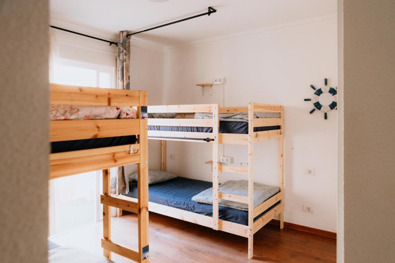 Cama en habitación compartida con 4 camas