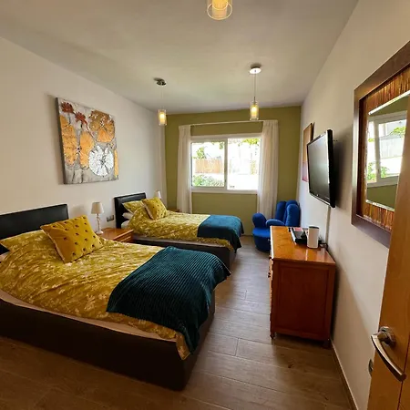 Villa Blossom In The Beautiful Area Of Puerto Santiago Tenerife With 5 Bedrooms For Up To 10 Guests Private Swimming Pool And Many Other Activities To Entertain The Family Secure Parking For 2 Cars And Disabled Access Throughout-2